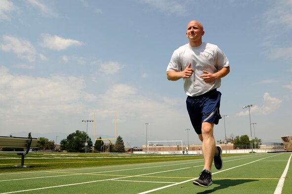 Staff Sgt. Justin Norton, a 302nd Airlift Wing Public Affairs photojournalist, lifts weights, Aug. 16, 2018, at Peterson Air Force Base, Colorado.