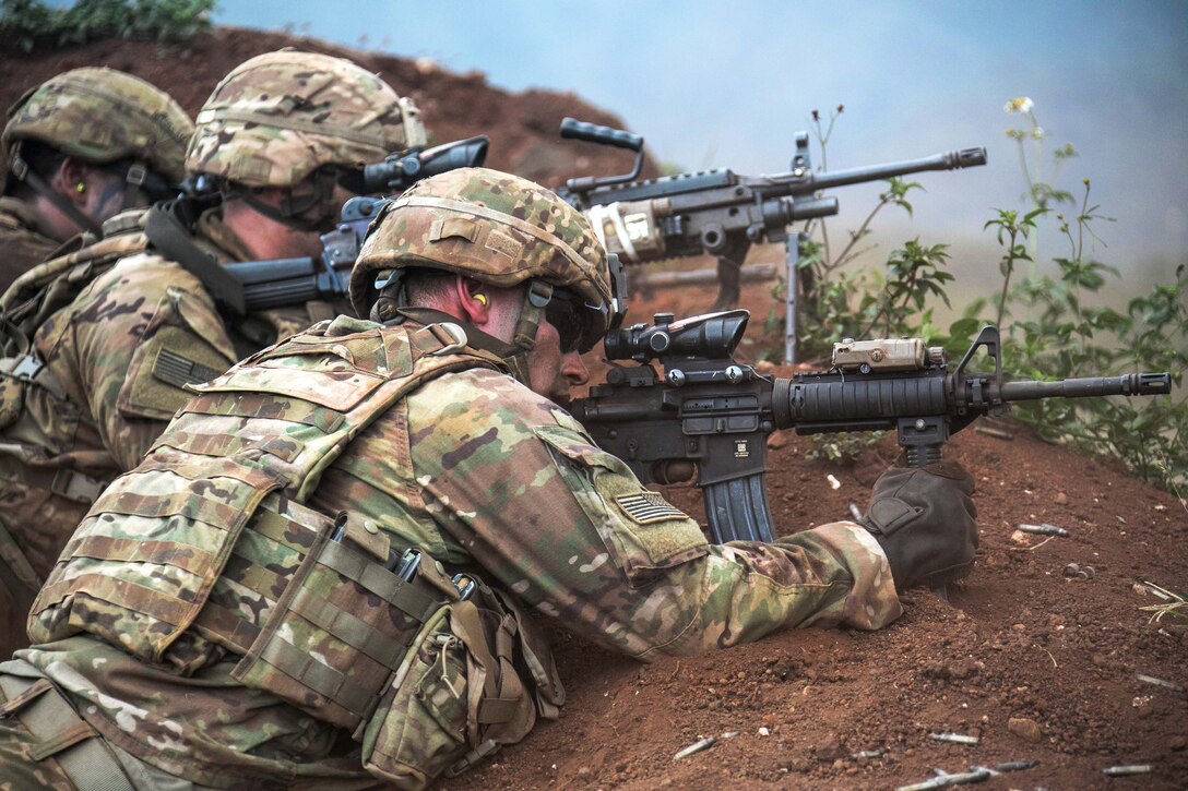 Soldiers provide suppressive fire at a combined arms live-fire exercise at Schofield Barracks, Hawaii.