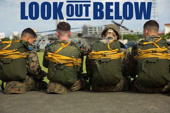 Marines with Landing Support Company, 3rd Transportation Support Battalion, 3rd Marine Logistics Group, wait next to the Camp Foster parade deck to board a CH-53E Super Stallion helicopter during parachute and air delivery training operations Aug. 14, 2018 at Ie Shima, Okinawa, Japan. The training consisted of low-level static line and military free fall jumps at 10,000 feet in order to keep the Marines proficient as parachute rigger/air delivery specialists. (U.S. Marine Corps photo by Cpl. Isabella Ortega)