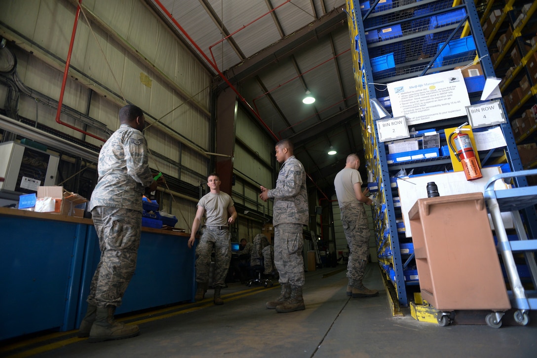 U.S. Air Force Airmen from the 100th Logistics Readiness Squadron have an end of day briefing in the aircraft parts store warehouse at RAF Mildenhall, England, Aug. 8, 2018. The aircraft parts store's main purpose is to provide flightline support to the aircraft maintenance crews 24-hours a day, seven-days-a-week. (U.S. Air Force photo by Airman 1st Class Alexandria Lee)