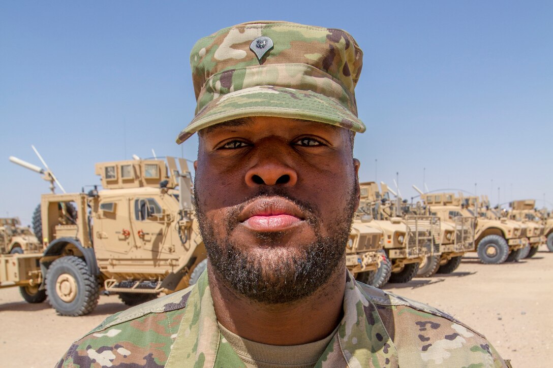 A soldier poses for a photo while deployed to Kuwait.