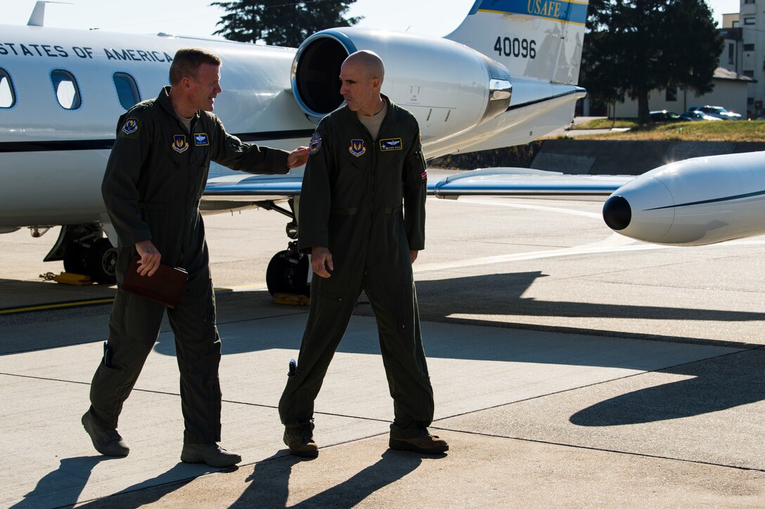 U.S. Air Force Gen. Tod D. Wolters, U.S. Air Forces in Europe-Air Forces Africa commander, arrives at Spangdahlem Air Base, Germany, Aug. 16, 2018. Col. Jason Bailey, 52nd Fighter Wing commander, greeted Wolters and discussed the day's itinerary. Wolters held an all call at Hangar 1 and met with Airmen and the media.  (U.S. Air Force photo by Airman 1st Class Valerie Seelye)