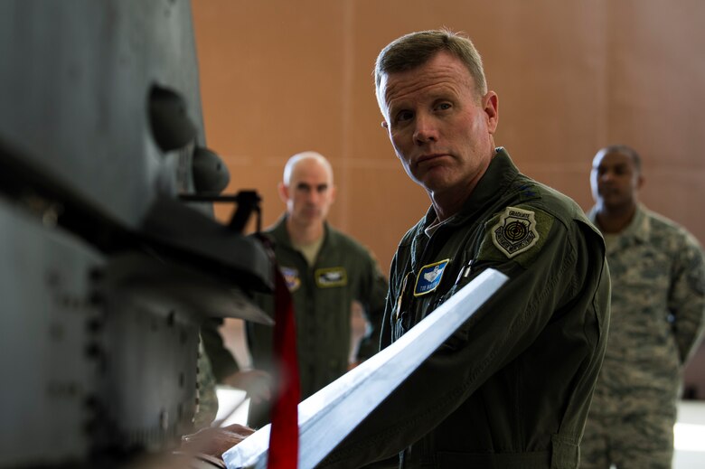 U.S. Air Force Gen. Tod D. Wolters, U.S. Air Forces in Europe-Air Forces Africa commander, Col. Jason Bailey, 52nd Fighter Wing commander, and Chief Master Sgt. Alvin Dyer, 52nd Fighter Wing command chief, speak with Airmen in a hardened aircraft shelter at Spangdahlem Air Base, Germany, Aug. 16, 2018. Airmen briefed the general on new equipment and changes at Spangdahlem. (U.S. Air Force photo by Airman 1st Class Valerie Seelye)