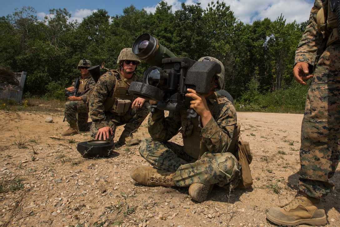 A Marine with Weapons Company, 3rd Battalion, 25th Marine Regiment, aims an FGM-148 Javelin Missile during Exercise Northern Strike at Camp Grayling, Mich., Aug. 14, 2018.