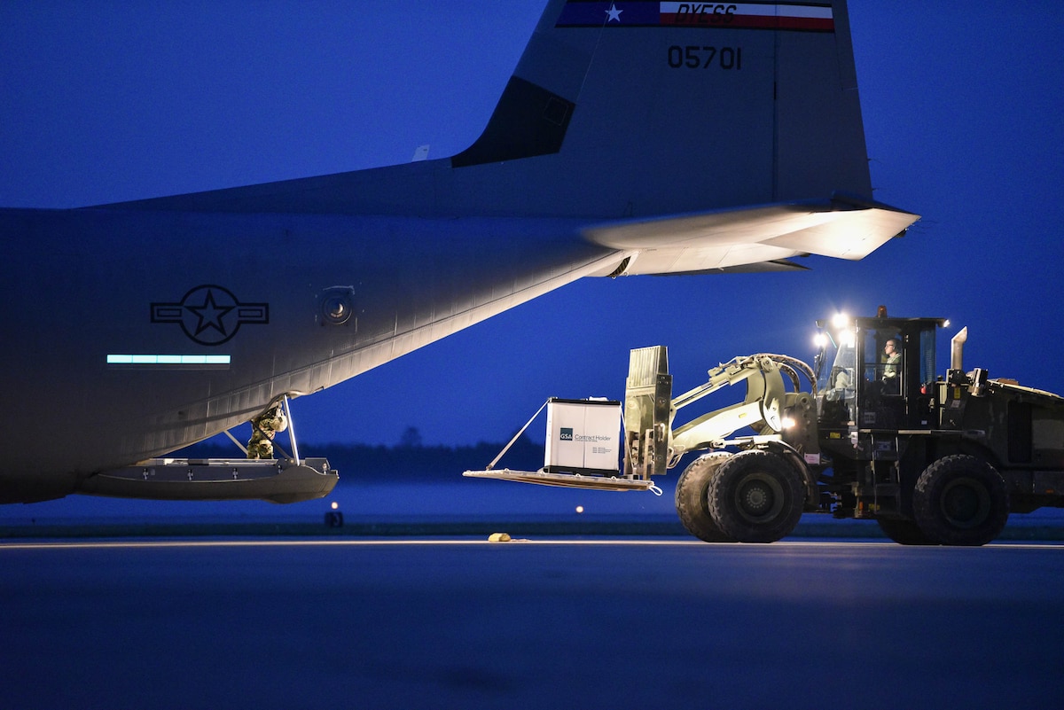 Members of the Kentucky Air National Guard’s 123rd Contingency Response Group conduct cargo off-load operations with a C-130 Hercules during Operation Huron Thunder at the Alpena Combat Readiness Training Center in Alpena, Mich., July 23, 2018. The 123rd CRG worked in conjunction with the U.S. Army’s 690th Rapid Port Opening Element to operate a Joint Task Force-Port Opening during the exercise. The objective of the JTF-PO is to establish a complete air logistics hub and surface distribution network. (U.S. Air National Guard photo by Maj. Allison Stephens)