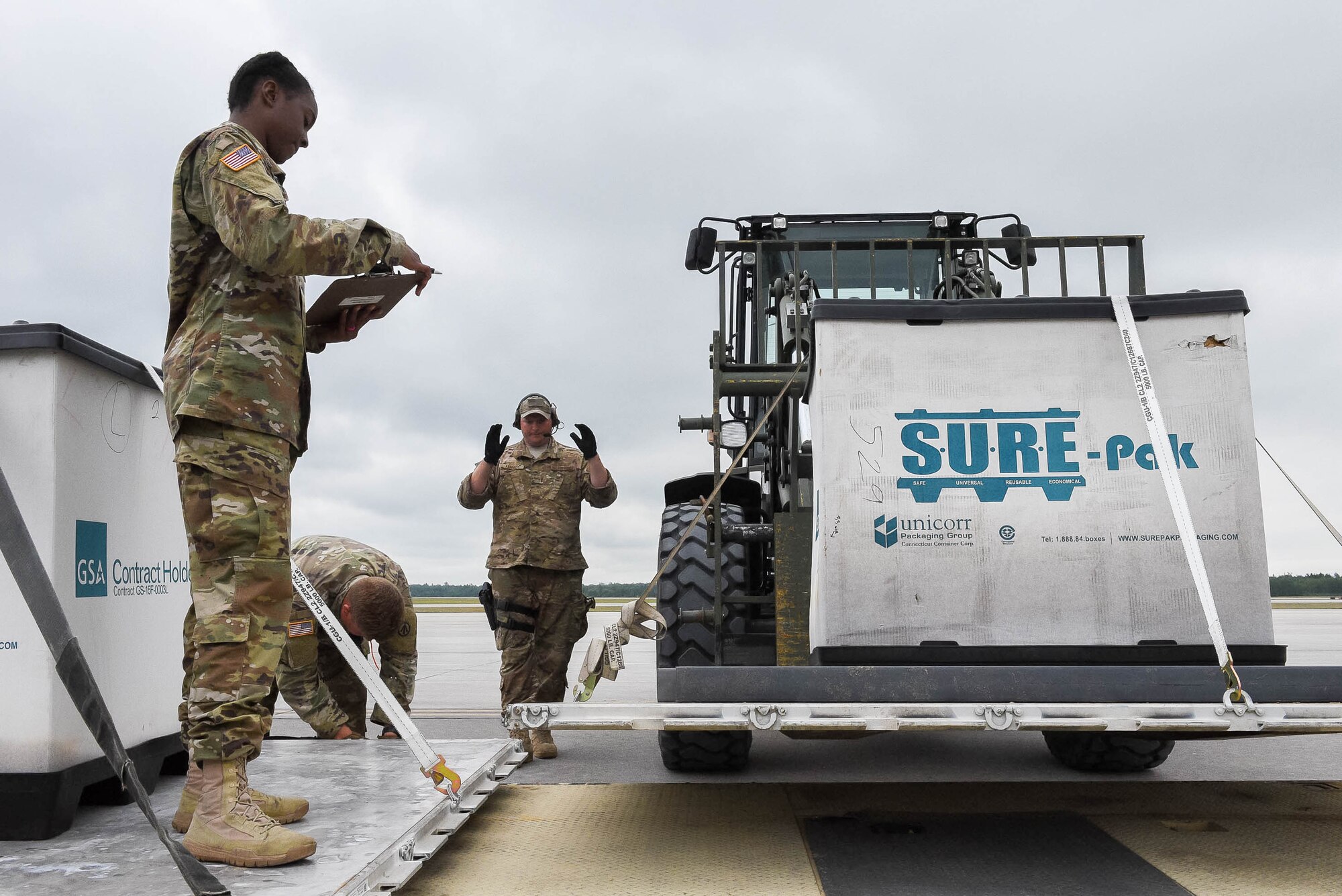 Tech. Sgt. Jason Kennedy, an aerial port specialist assigned to the Kentucky Air National Guard’s 123rd Contingency Response Group, directs a cargo palette to a cargo distribution area while supporting Operation Huron Thunder at the Alpena Combat Readiness Training Center in Alpena, Mich., July 22, 2018. The 123rd CRG worked in conjunction with the U.S. Army’s 690th Rapid Port Opening Element to operate a Joint Task Force-Port Opening during the exercise. The objective of the JTF-PO is to establish a complete air logistics hub and surface distribution network. (U.S. Air National Guard photo by Maj. Allison Stephens)