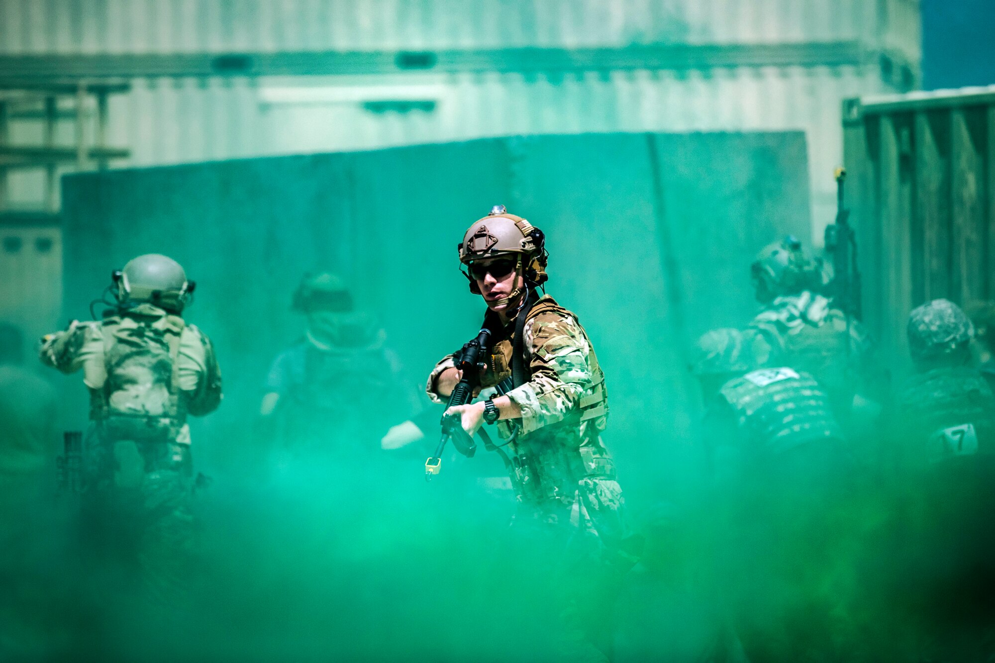 An Airman checks behind a simulated military escort for combatants at the Emergency Medical Technician Rodeo at Melrose Air Force Range, N.M., August 8, 2018. A total of 21 Air Force bases from around the world visited MAFR and Cannon Air Force Base, New Mexico, to participate in the EMT Rodeo, giving the technicians a wide assortment of scenarios to test their knowledge and training in the medical field. (U.S. Air Force photo by Airman 1st Class Gage Adison Daniel)