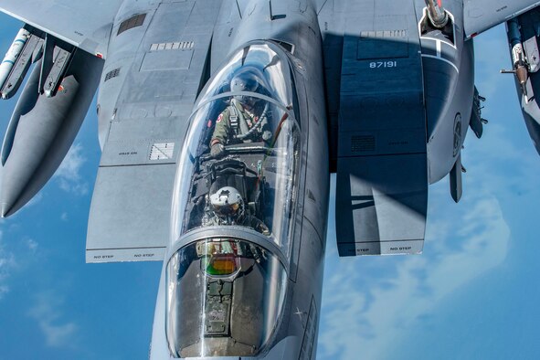 A KC-135 Stratotanker with the 121st Air Refueling Wing, Ohio refuels an F-15E Strike Eagle with the 4th Fighter Wing at Seymour Johnson Air Force Base, North Carolina over the southeastern United States August 8, 2018. The aerial refueling was an exercise to keep pilots and crew proficient and mission ready.  (U.S. Air National Guard photo by Airman 1st Class Tiffany A. Emery)
