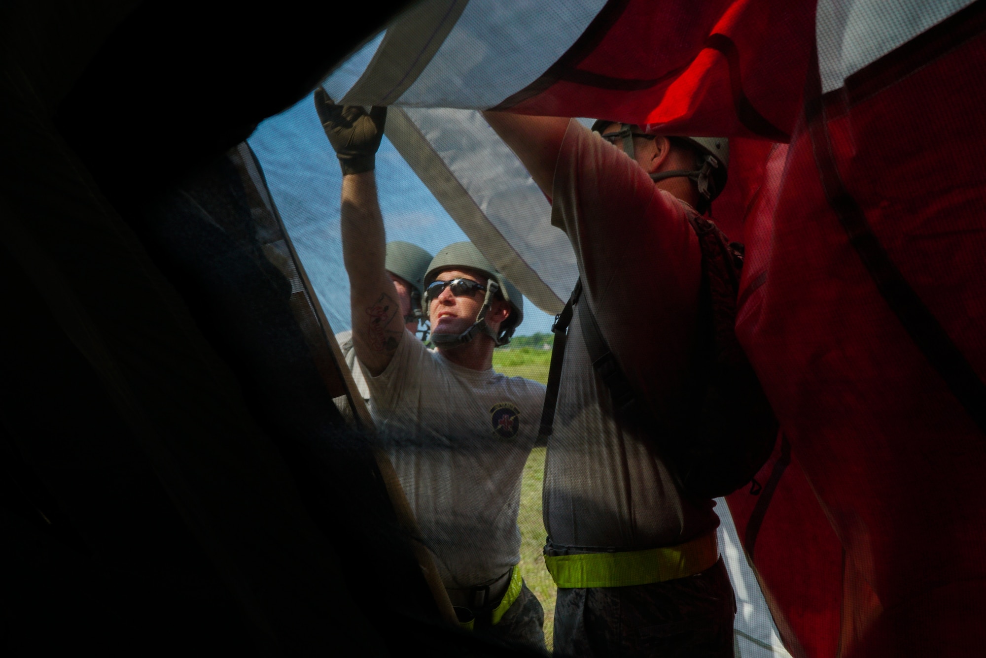 U.S. Air Force Staff Sgt. Randall Miller, left, and Tech Sgt. Richard Thomas, both assigned to the 927th Aeromedical Staging Squadron, MacDill AFB, Fla., participate in the set up of the En-route Patient Staging System during exercise Patriot Warrior at Fort McCoy, Wis., Aug. 10, 2018. Patriot Warrior is Air Force Reserve Command’s premier exercise, providing an opportunity for Reserve Airmen to train with joint and international partners in airlift, aeromedical evacuation and mobility support. (U.S. Air Force Photo by Staff Sgt. Amy Picard)