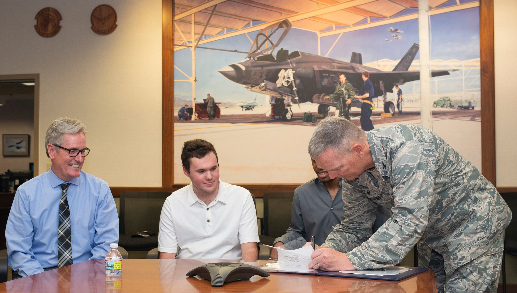 U.S. Air Force Col. Robert Sylvester, 56th Mission Support Group commander, signs an educational opportunities memorandum with the West Maricopa Education Center Aug. 14, 2018, at Luke Air Force Base, Ariz.