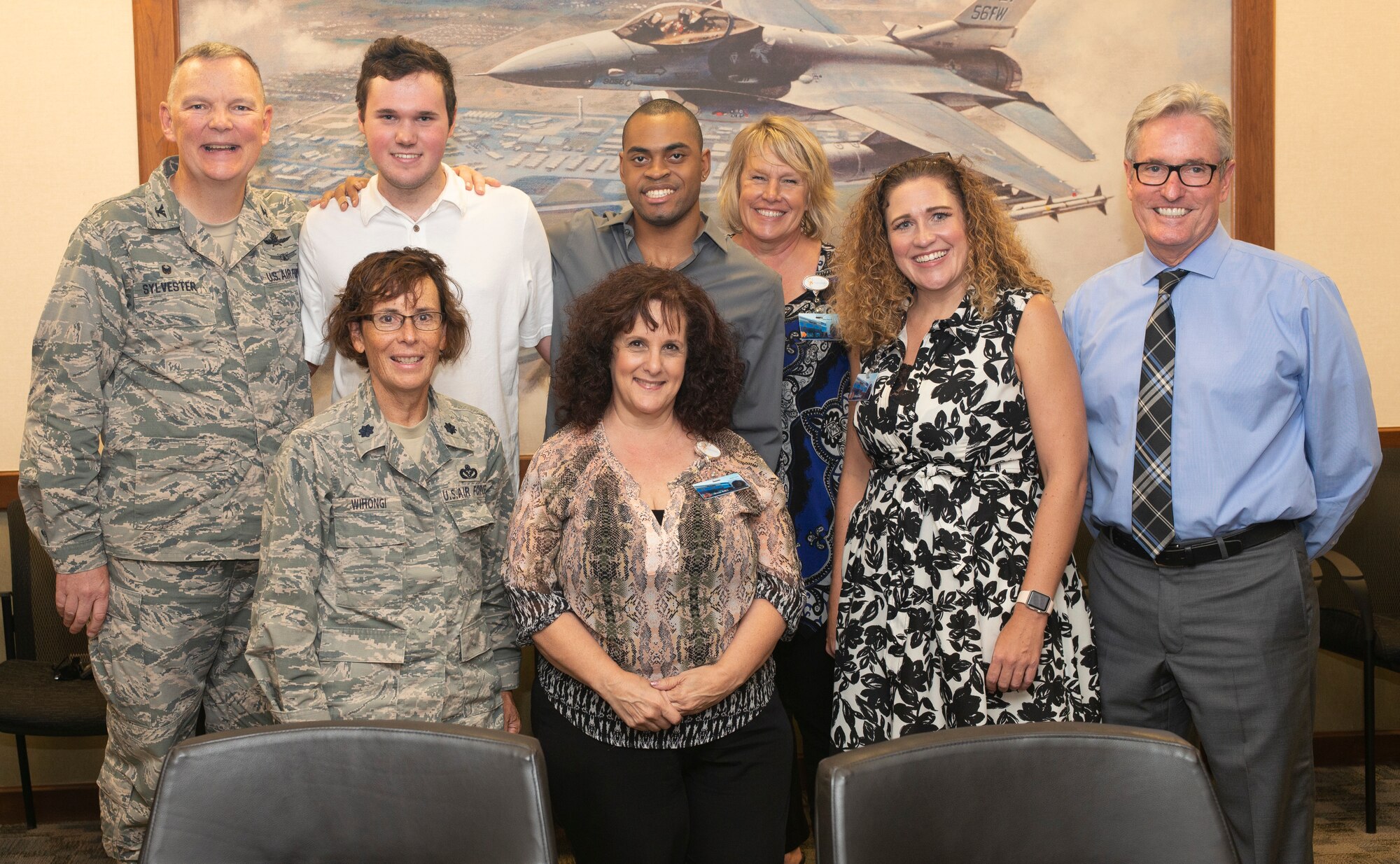 Leadership from Luke Air Force Base poses for a group photo with staff from the West Maricopa Education Center Aug. 14, 2018, at Luke Air Force Base, Ariz.