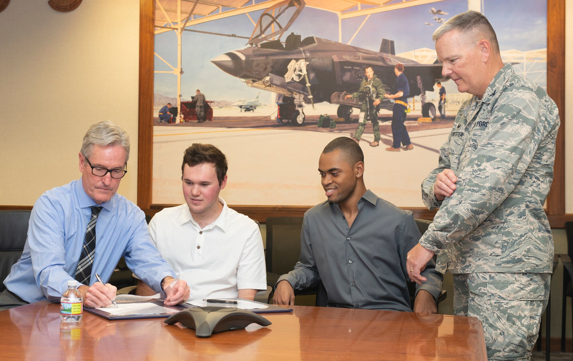 John Mulcahy, Assistant Superintendent of Professional Development and Adult Education at the West Maricopa Education Center, signs an educational opportunities memorandum with Luke Air Force Base Aug. 14, 2018, at Luke Air Force Base, Ariz.