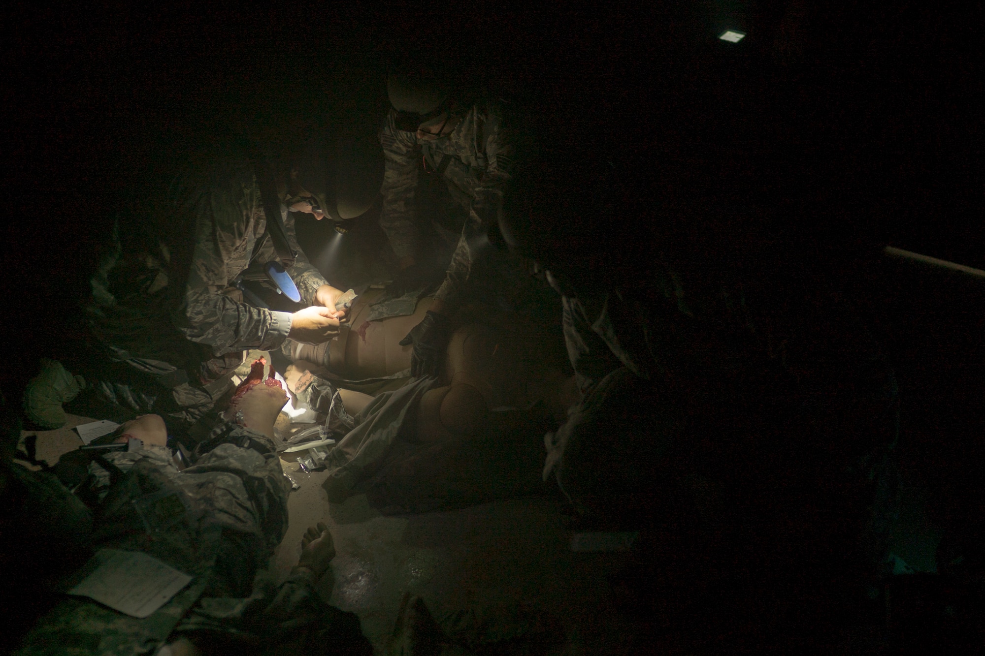 Aerospace medical technicians from the U.S. Air Force Reserve 927th Aeromedical Staging Squadron, MacDill Air Force Base, Fla., participate in Tactical Combat Casualty Care training during Exercise Patriot Warrior 2018 at Fort McCoy, WI, August 15, 2018. Patriot Warrior is Air Force Reserve Command's premier exercise, providing an opportunity for Reserve Airmen to train with joint and international partners in airlift, aeromedical evacuation and mobility support operations. (U.S. Air Force photo by Staff Sgt. Nicholas A. Priest)