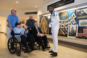 A sailor gives World War II veterans a tour of the Pentagon.