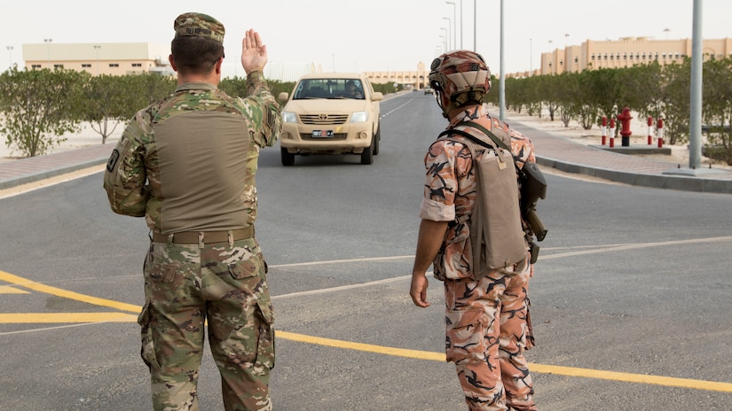 U.S. Army Staff Sgt. Christopher Reitz, a team lead assigned to the 157th Military Engagement Team, Wisconsin Army National Guard, attached to U.S. Army Central, instructs a driver to approach a vehicle control point at a practical exercise held in Haima, Oman, Aug. 8, 2018. During the practical exercise Soldiers from the 157th MET and the Royal Army of Oman's Border Guard Brigade shared their preferred techniques and methods to conduct border security to strengthen both country's defensive capabilities.