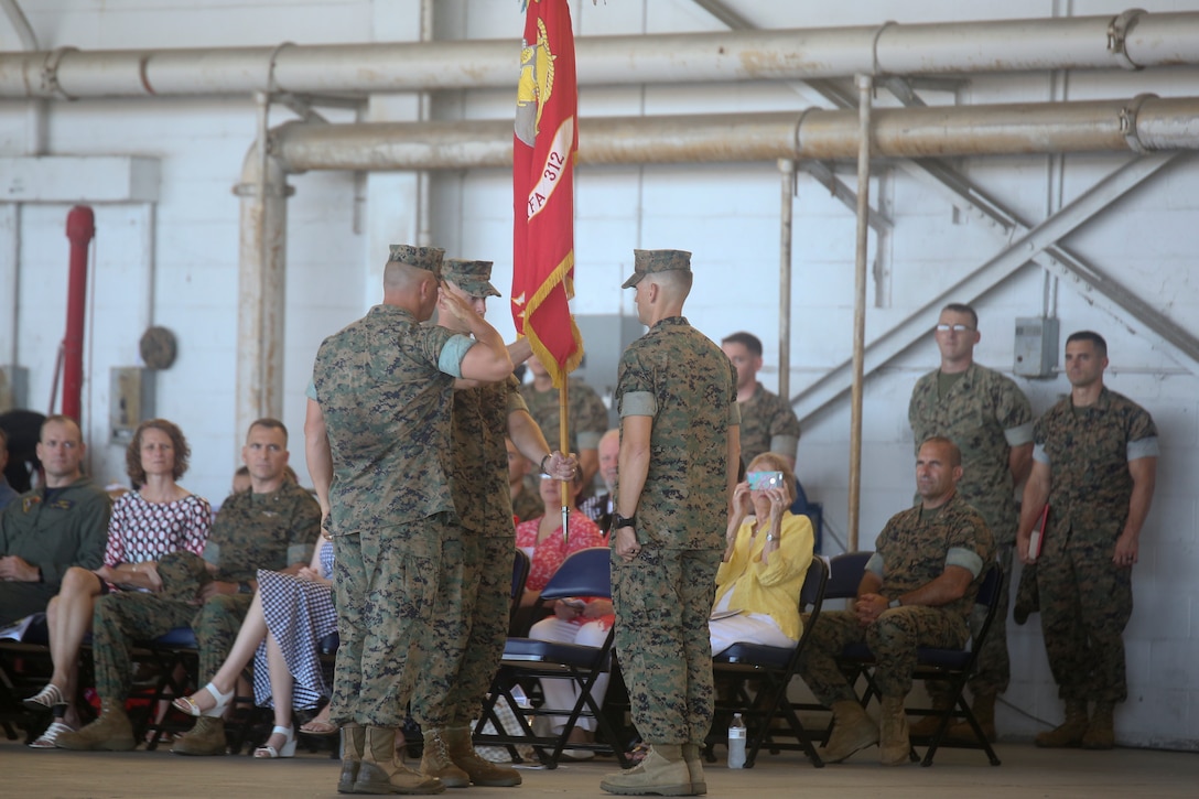 Lt. Col. Benedict G. Buerke relinquishes command of Marine Fighter Attack Squadron 312 to Lt. Col. Steven B. Bowden aboard Marine Corps Air Station Beaufort Aug. 10.
During the ceremony, Buerke was awarded the Bronze Star for his service as the commanding officer of the Checkerboards.