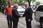 Defense Secretary James N. Mattis and Colombian Defense Minister Guillermo Botero stand at attention.