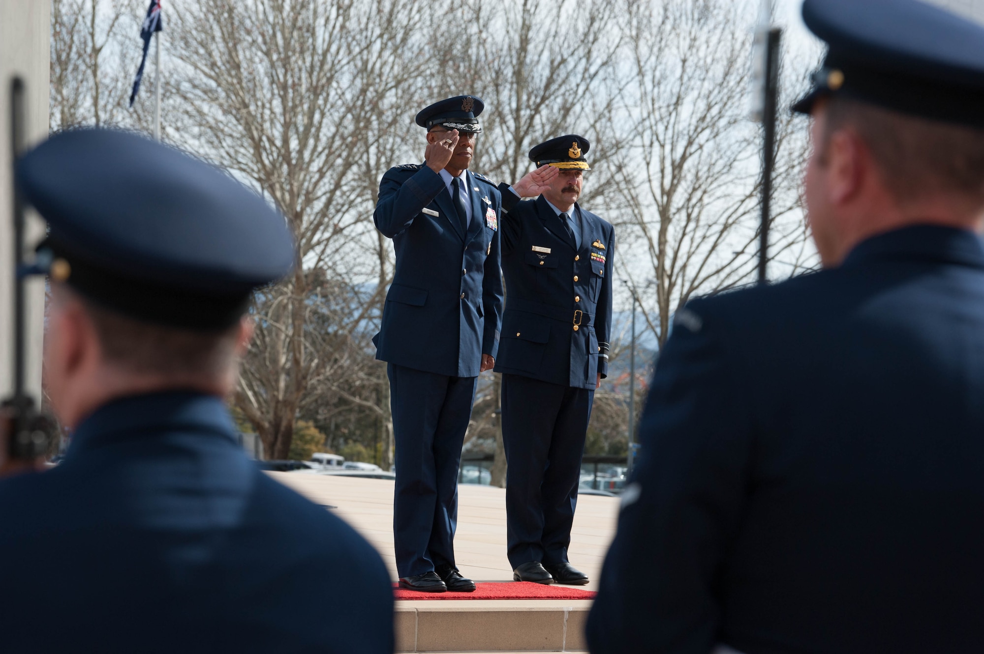 Gen. CQ Brown, Jr., Pacific Air Forces commander, and Air Marshal Leo Davies, Royal Australian Air Force (RAAF) chief of Air Force, salute Australia’s Federation Guard and band members during a ceremony at the Russell Offices, Canberra, Australia, Aug. 10, 2018. His first trip to the region since taking command on July 26, 2018, Brown met with key defense and military leaders in Canberra and RAAF Bases Williamtown, Tindal and Darwin to see first-hand the strength of the U.S.-Australia alliance and discuss opportunities to ensure a free and open Indo-Pacific region. (U.S. Air Force photo by Staff Sgt. Hailey Haux)