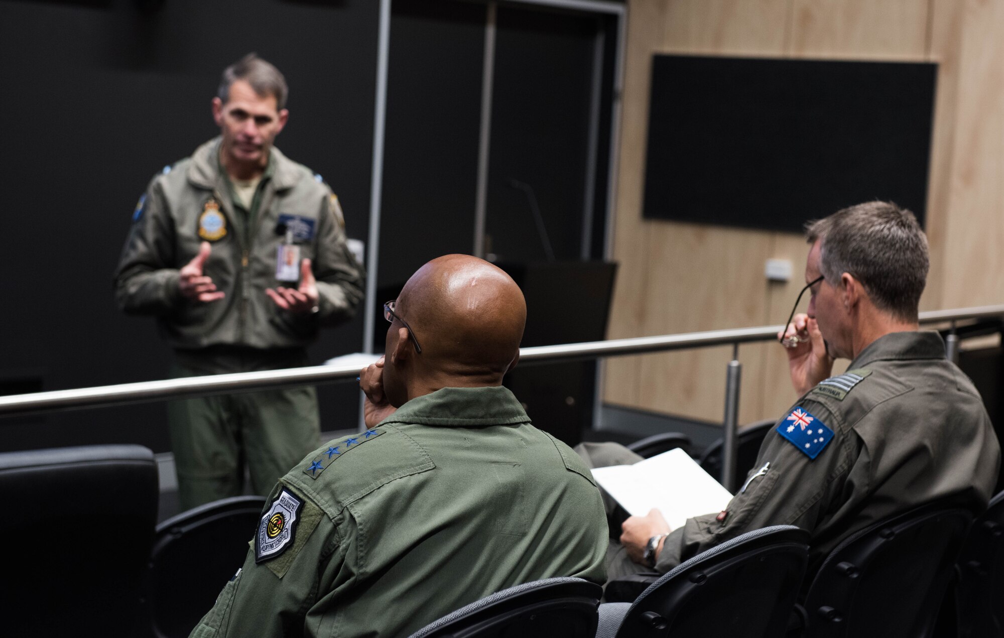 Gen. CQ Brown, Jr., Pacific Air Forces commander, attends a briefing by Air Commodore Rob Chipman, General Capability Planning director, at Royal Australian Air Force (RAAF) Base Williamtown, Australia, Aug. 9, 2018. His first trip to the region since taking command on July 26, 2018, Brown also met with key defense and military leaders in Canberra and RAAF Bases Tindal and Darwin to see first-hand the strength of the U.S.-Australia alliance and discuss opportunities to ensure a free and open Indo-Pacific region. (U.S. Air Force photo by Staff Sgt. Hailey Haux)
