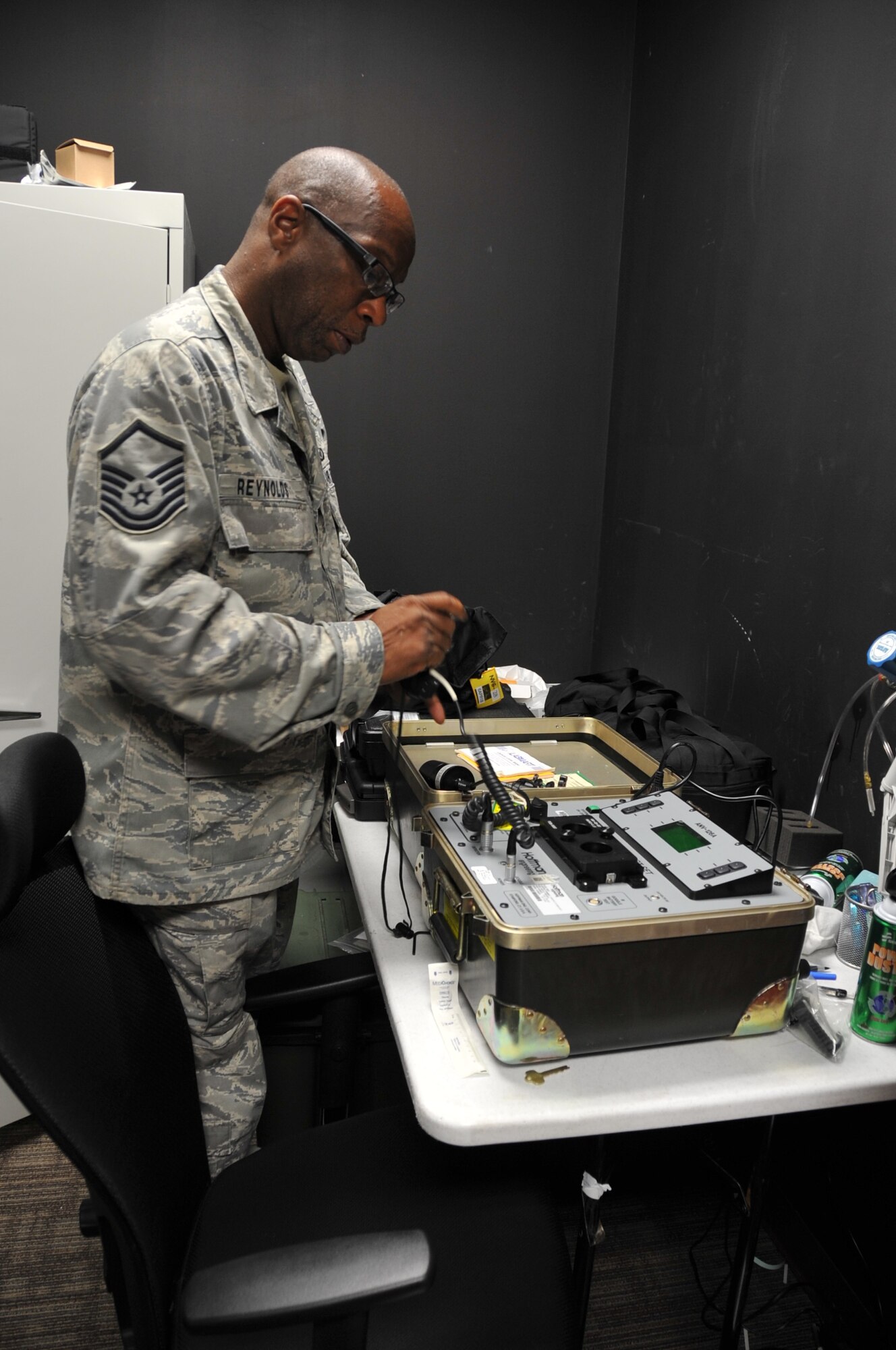 Master Sgt. Ray Reynolds, 403rd Operations Support Squadron aircrew flight equipment supervisor, plugs in a pair of night vison goggles for testing, which is given either a go for use or no go and needs repair. The equipment has to be inspected before and after every flight and a routine inspection is completed every 120 days. (U.S. Air Force photo by Master Sgt. Jessica Kendziorek)