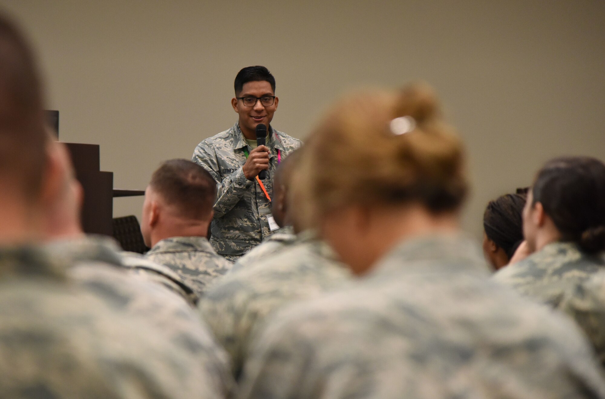 U.S. Air Force Airman 1st Class Aldair Concepcion, 81st Aerospace Medicine Squadron public health technician, delivers the medical briefing to Keesler Airmen during a deployment exercise at the Roberts Consolidated Aircraft Maintenance Facility on Keesler Air Force Base, Mississippi, Aug. 16, 2018. The exercise scenario tested the mission readiness of Team Keesler for deployments. (U.S. Air Force photo by Kemberly Groue)
