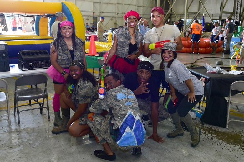 Airmen from the 434th Air Refueling Wing pose for a photo during a combat dining in at Grissom Air Reserve Base, Ind., Aug. 18, 2018. Grissom held its first combat dining in since 2007, where Airmen faced several fun challenges and were encouraged to show off their homemade uniforms. (U.S. Air Force Photo / Staff Sgt. Christopher Massey)