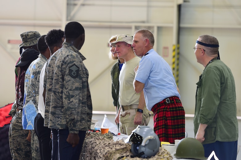 Col. Larry Shaw, 434th Air Refueling Wing commander, and leadership, speak with Airmen who completed the obstacle course during a combat dining in at Grissom Air Reserve Base, Ind., Aug. 18, 2018. Grissom held its first combat dining in since 2007, where Airmen faced several fun challenges and were encouraged to show off their homemade uniforms. (U.S. Air Force Photo / Staff Sgt. Christopher Massey)