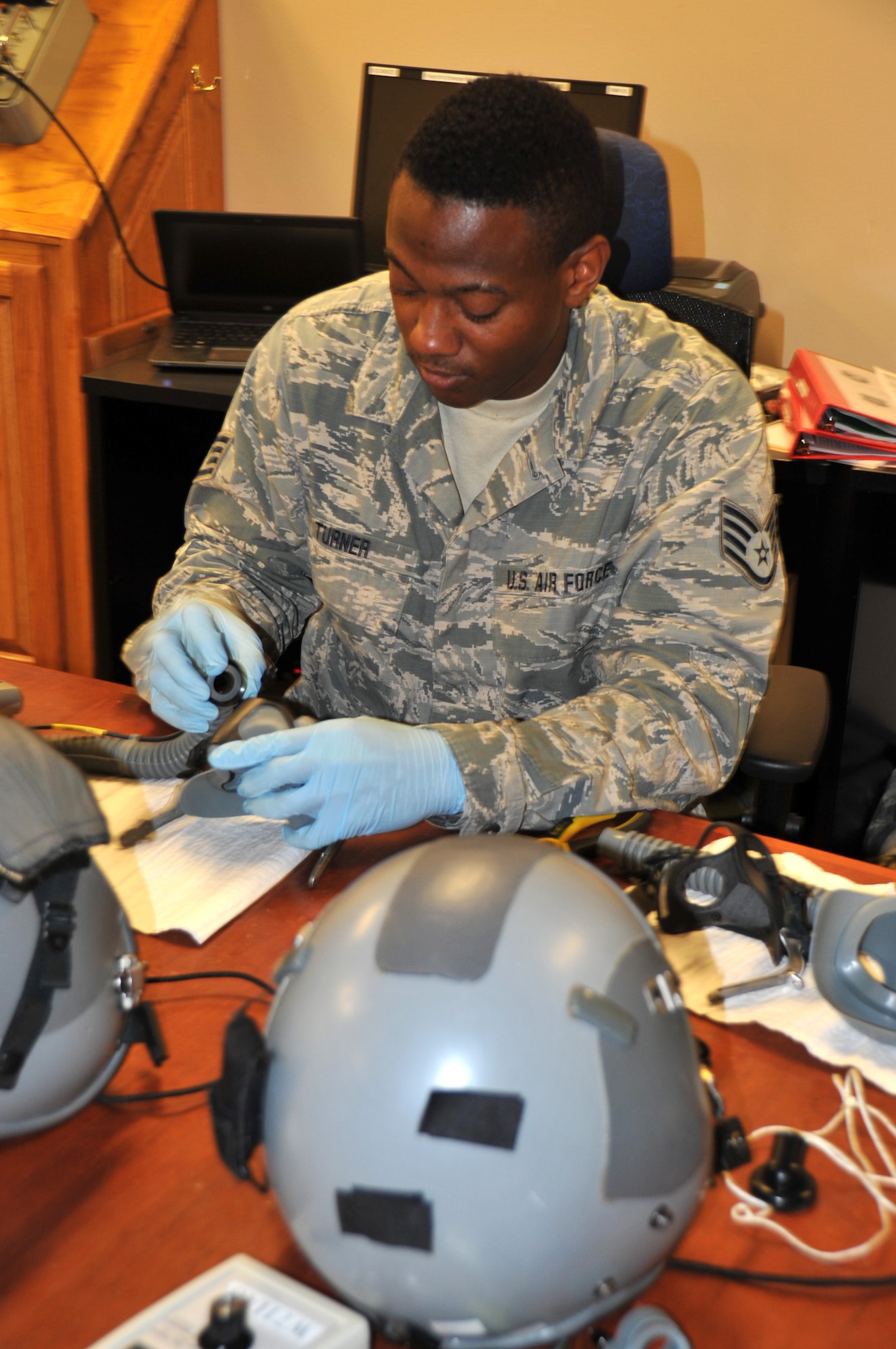 Staff Sgt. Devante Turner, 403rd Operations Support Squadron aircrew flight equipment specialist, is conducting a routine inspection of equipment. The equipment has to be inspected before and after every flight and a routine inspection is completed every 120 days. (U.S. Air Force photo by Master Sgt. Jessica Kendziorek)