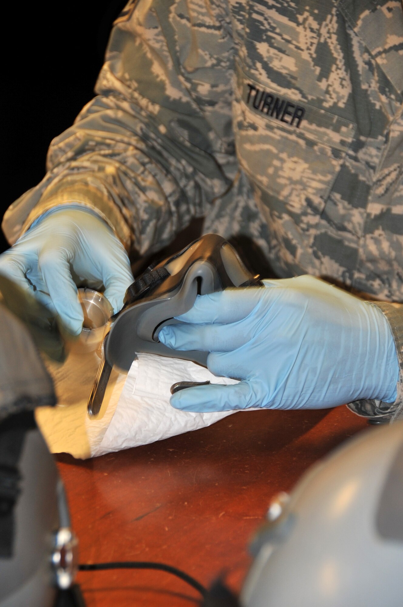 Staff Sgt. Devante Turner, 403rd Operations Support Squadron aircrew flight equipment specialist, is conducting a routine inspection of equipment. The equipment has to be inspected before and after every flight and a routine inspection is completed every 120 days. (U.S. Air Force photo by Master Sgt. Jessica Kendziorek)