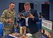 Senior Airman Alan Daniels, 11th Medical Group cardiopulmonary lab technician, speaks with Bill Snow from Regent University during an education fair at Joint Base Andrews, Md., Aug. 16, 2018. At each booth, prospective students learned about topics such as admissions processes, degree programs and school offerings. (U.S. Air Force photo by Senior Airman Abby L. Richardson)