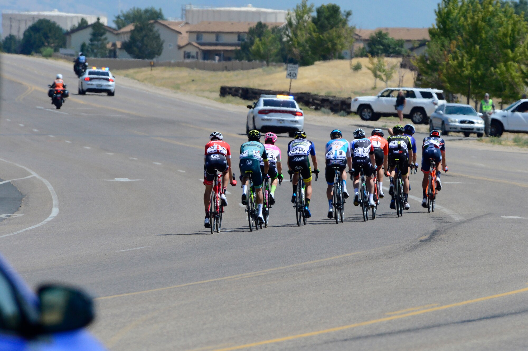 A breakaway of 10 riders during stage 3 of the 2018 Tour of Utah road race Aug. 9, 2018, at Hill Air Force Base, Utah. The Tour of Utah is one of the top professional cycling events in the country and showcases some of the world’s best teams and cyclists. Stage 3 of the multiday race took riders on a 116-mile route from Antelope Island to Layton and included a loop through the installation. (U.S. Air Force photo by David Perry)