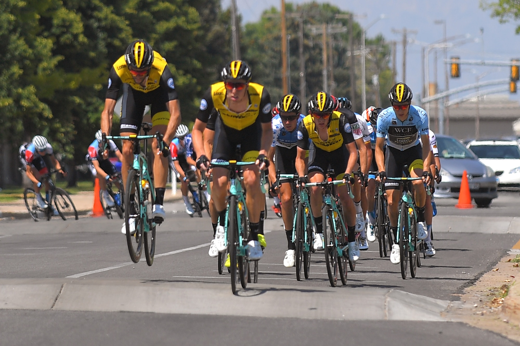 The peloton exist the base during stage 3 of the 2018 Tour of Utah road race Aug. 9, 2018, at Hill Air Force Base, Utah. The Tour of Utah is one of the top professional cycling events in the country and showcases some of the world’s best teams and cyclists. Stage 3 of the multiday race took riders on a 116-mile route from Antelope Island to Layton and included a loop through the installation. (U.S. Air Force photo by Todd Cromar)