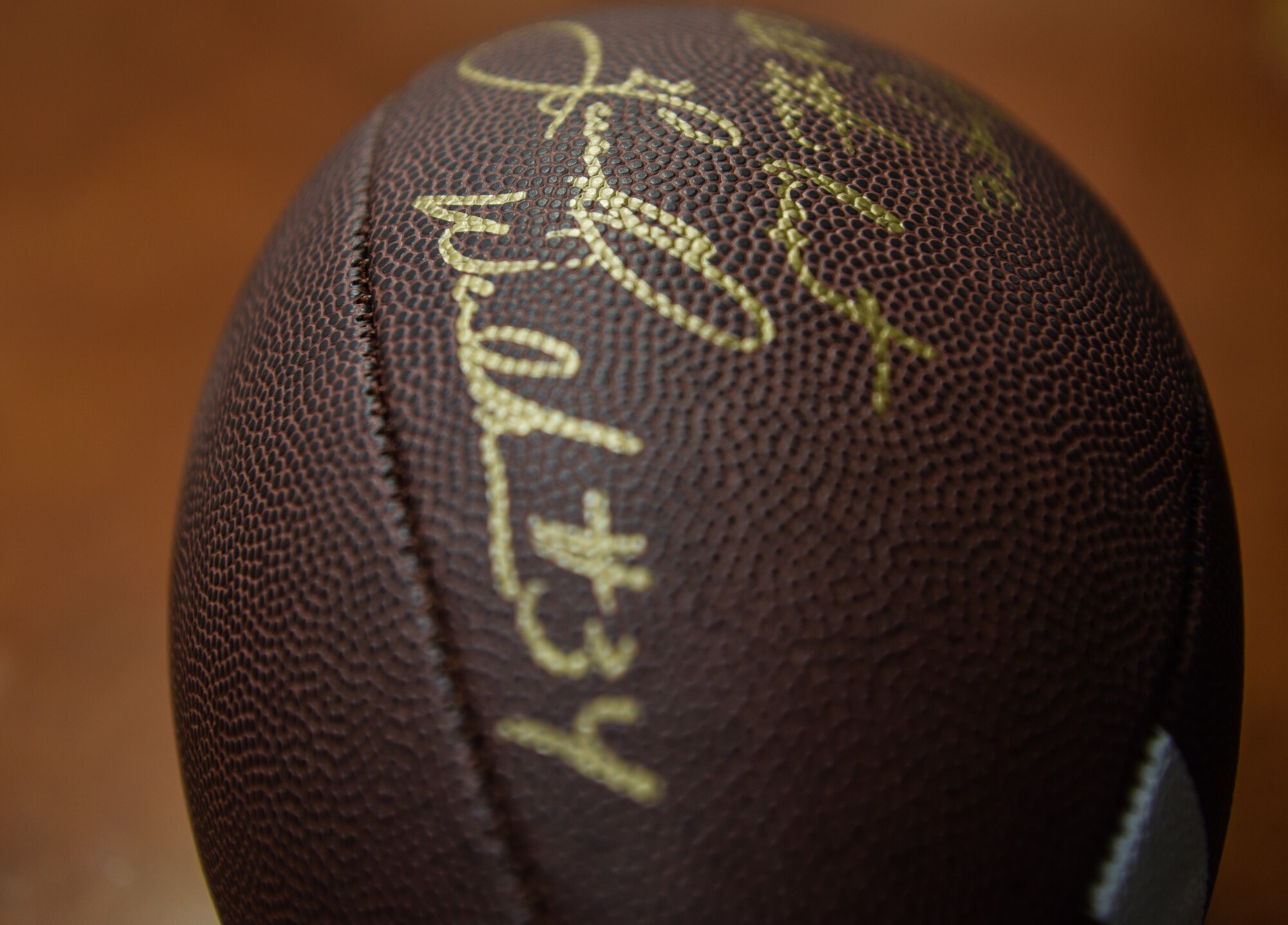 A football signed by Herschel Walker, for a 90th Missile Wing Airmen Aug. 14, 2018, during his visit to F.E. Warren Air Force Base, Wyo. Walker spent the day talking with Airmen and learning about the 90th Missile Wing mission and the rich history of F.E. Warren AFB. (U.S. Air Force photo by Airman 1st Class Braydon Williams)