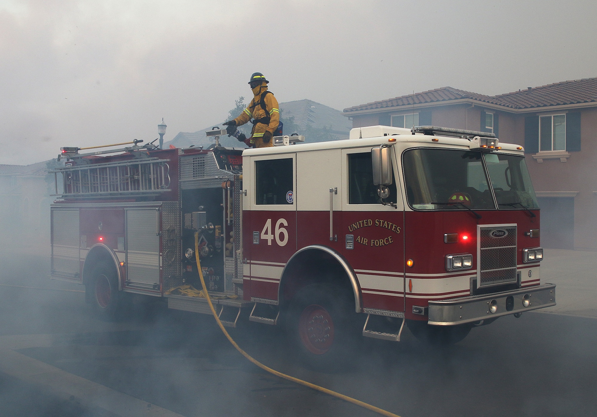 Firefighters from Travis Air Force Base, Calif., work to prevent the spread of the Nelson Fire in Vacaville, Calif., Aug. 10. Travis dispatched 12 firefighters, two fire engines and one water tanker to support firefighting efforts. The fire scorched 2,162 acres before it was extinguished. (Courtesy photo by Matthew Henderson) Facebook.com/onfirephotos