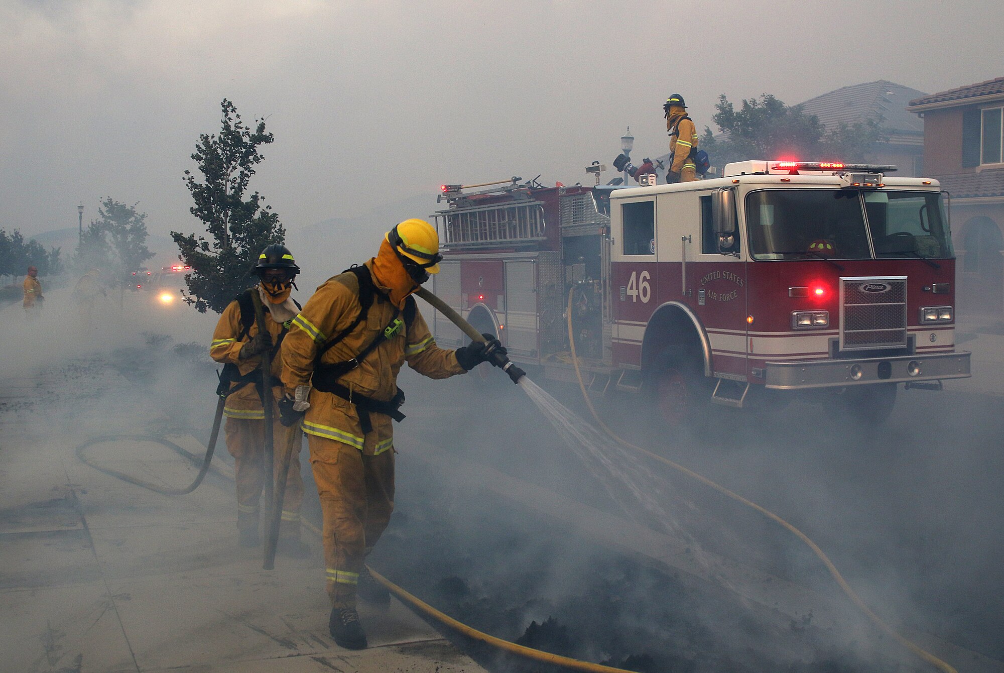 Firefighters from Travis Air Force Base, Calif., work to prevent the spread of the Nelson Fire in Vacaville, Calif., Aug. 10. Travis dispatched 12 firefighters, two fire engines and one water tanker to support firefighting efforts. The fire scorched 2,162 acres before it was extinguished. (Courtesy photo by Matthew Henderson) Facebook.com/onfirephotos