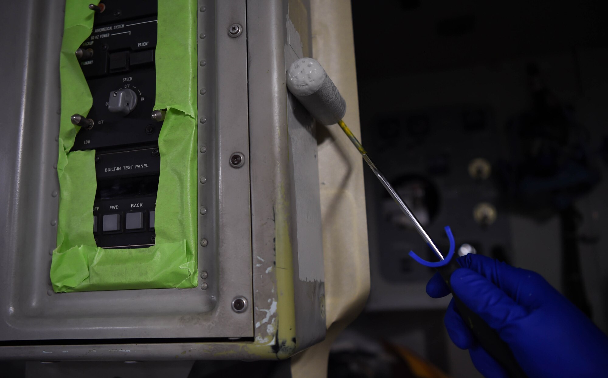 Staff Sgt. Fernando Ortiz, 60th Maintenance Squadron aircraft structure maintenance technician, paints the inside of a C-17 Globemaster III from Travis Air Force Base, Calif., Aug. 6, 2018, at Joint Base Lewis-McChord, Wash. Painting aircrafts is a large part of corrosion prevention that help maintain the longevity of the jets. (U.S. Air Force photo by Senior Airman Tryphena Mayhugh)