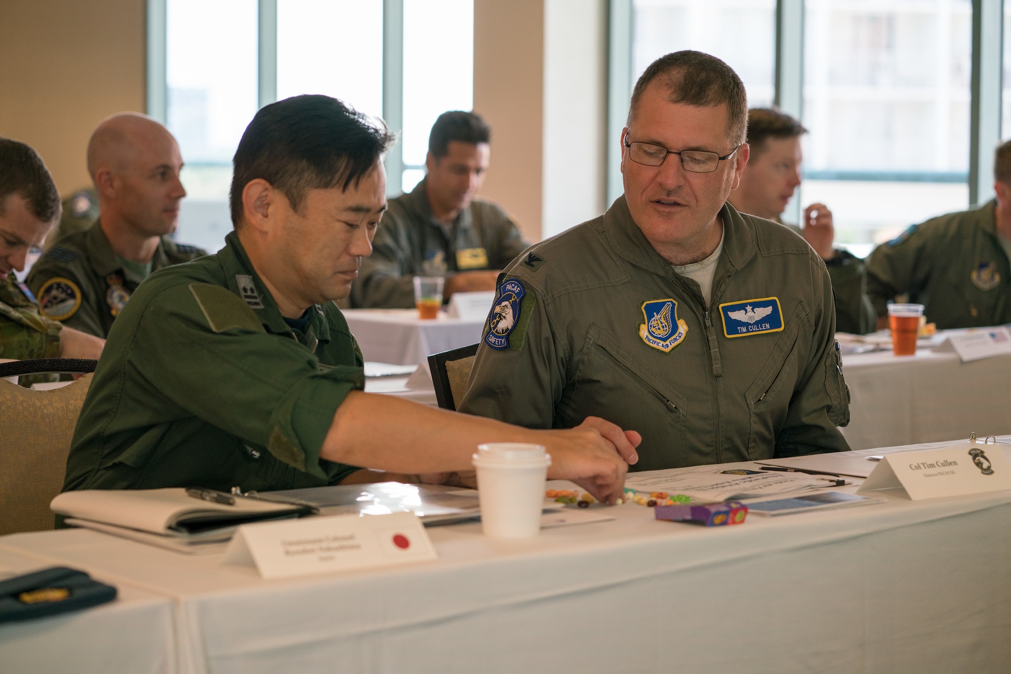 Koku-Jieitai (Japan Air Self-Defense Force) Lt. Col. Ryouhei Nakashima (left) and U.S. Air Force Col. Tim Cullen, Pacific Air Forces director of safety, work together during a group activity as part of the Asia-Pacific Aviation Safety Subject Matter Expert Exchange (APASS) in Honolulu, Hawaii, Aug. 14, 2018. APASS allows partner nations in the Indo-Pacific to discuss aviation safety practices and devise solutions to challenges faced by the various air forces. (U.S. Air Force photo by Staff Sgt. Daniel Robles)