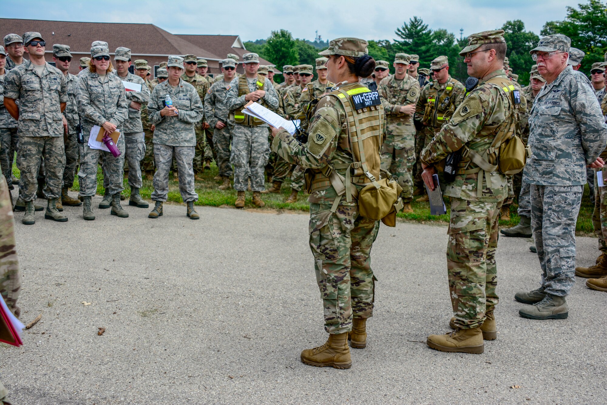 Joint military members with the Wisconsin Chemical, Biological, Radiological, Nuclear and High Yield Explosive Enhanced Response Force Package receive a safety brief prior to their the External Evaluation exercise at Volk Field Air National Guard Base, Aug. 16, 2018. The ExEval is conducted as a way to re-validate the WI CERFP to perform its CBRN Response Enterprise mission in support of the State and Nation.(U.S. Air National Guard photo by Tech. Sgt. Mary E. Greenwood)