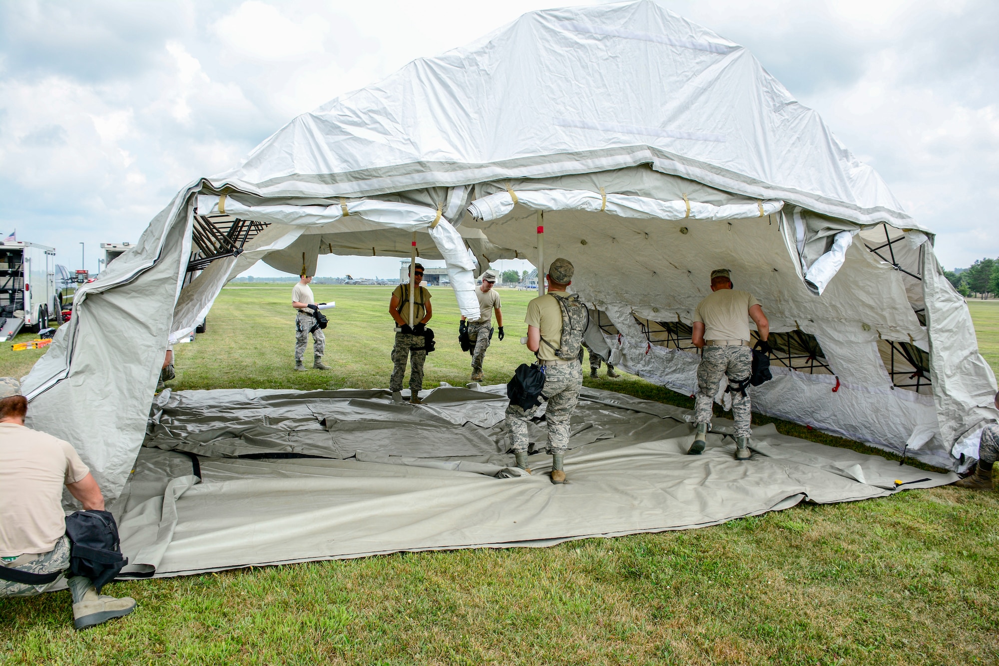 Airmen with the 115th Fighter Wing Fatality Search and Rescue Team set up a mobile workstation for the Wisconsin Chemical, Biological, Radiological, Nuclear and High Yield Explosive Enhanced Response Force Package External Evaluation exercise at Volk Field Air National Guard Base, Aug. 16, 2018. The ExEval is conducted as a way to re-validate the WI CERFP to perform its CBRN Response Enterprise mission in support of the State and Nation. (U.S. Air National Guard photo by Tech. Sgt. Mary E. Greenwood)