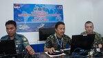 Petty Officer 2nd Class Herman Syah (left), and Petty Officer 1st Class Sudarsano, (middle), of the Indonesian Navy, and Electronics Techinician 2nd Class Andrew Slabaugh, aasigned to Commander, Task Force 73 (CTF73), work together as part of Combined Enterprise Regional Exchange (CENTRIX), at 1st Fleet Training Command, in Jakarta, Indonesia, during Cooperation Afloat Readiness (CARAT), Indonesia. CARAT Indonesia, in its 24th iteration, is designed to enhance information sharing and coordination, build mutual warfighting capability and support long-term regional cooperation enabling both partner armed forces to operate effectively together as a unified maritime force.