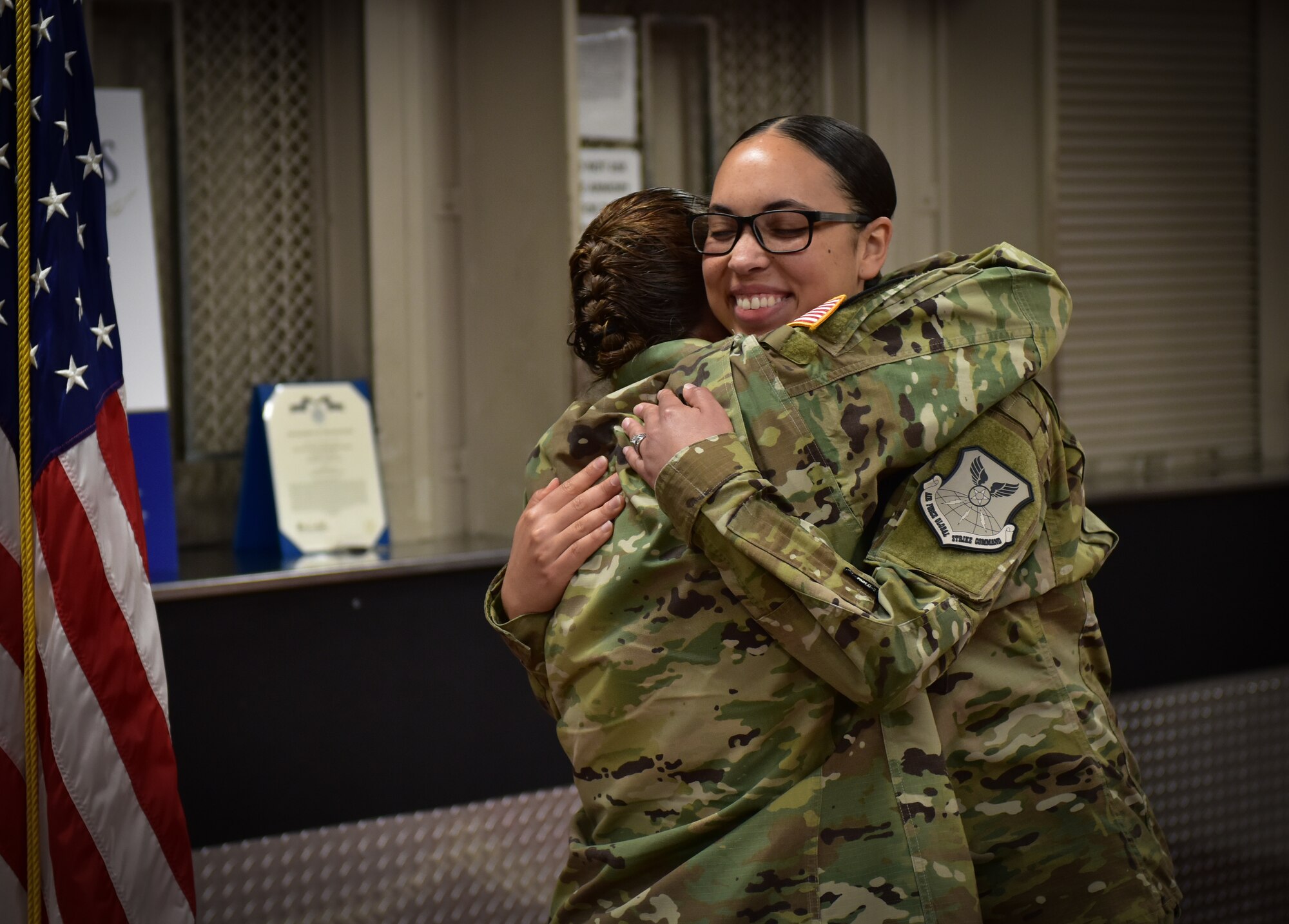 U.S. Army Maj. Darla Deauvearo, left, hugs her daughter 2nd Lt. Jasmine Scott, Aug. 10, 2018, after she read her the oath of office during a commissioning ceremony at Whiteman Air Force Base. Scott was a member of the 509th Bomb Wing and commissioned into the medical services field.  (U.S. Air Force photo by Tech. Sgt. Alexander W. Riedel)