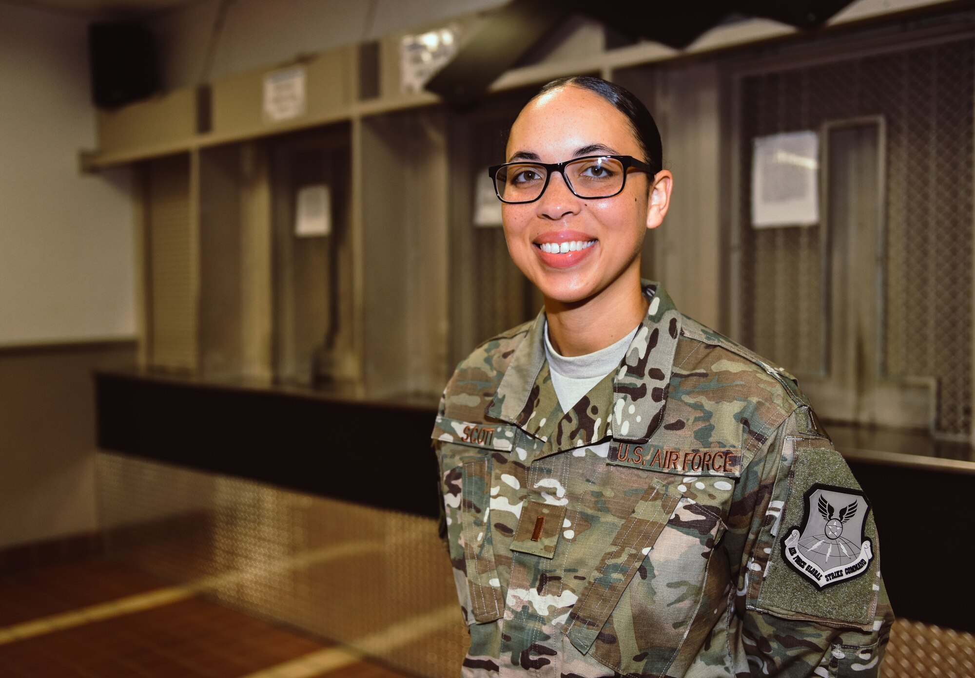 Second Lt. Jasmine Scott smiles after her commissioning ceremony concluded Aug. 10, 2018, at Whiteman Air Force Base, Mo. Scott commissioned into the medical services corps, after serving as an enlisted armorer at the 509th Security Forces Squadron. (U.S. Air Force photo by Tech. Sgt. Alexander W. Riedel)