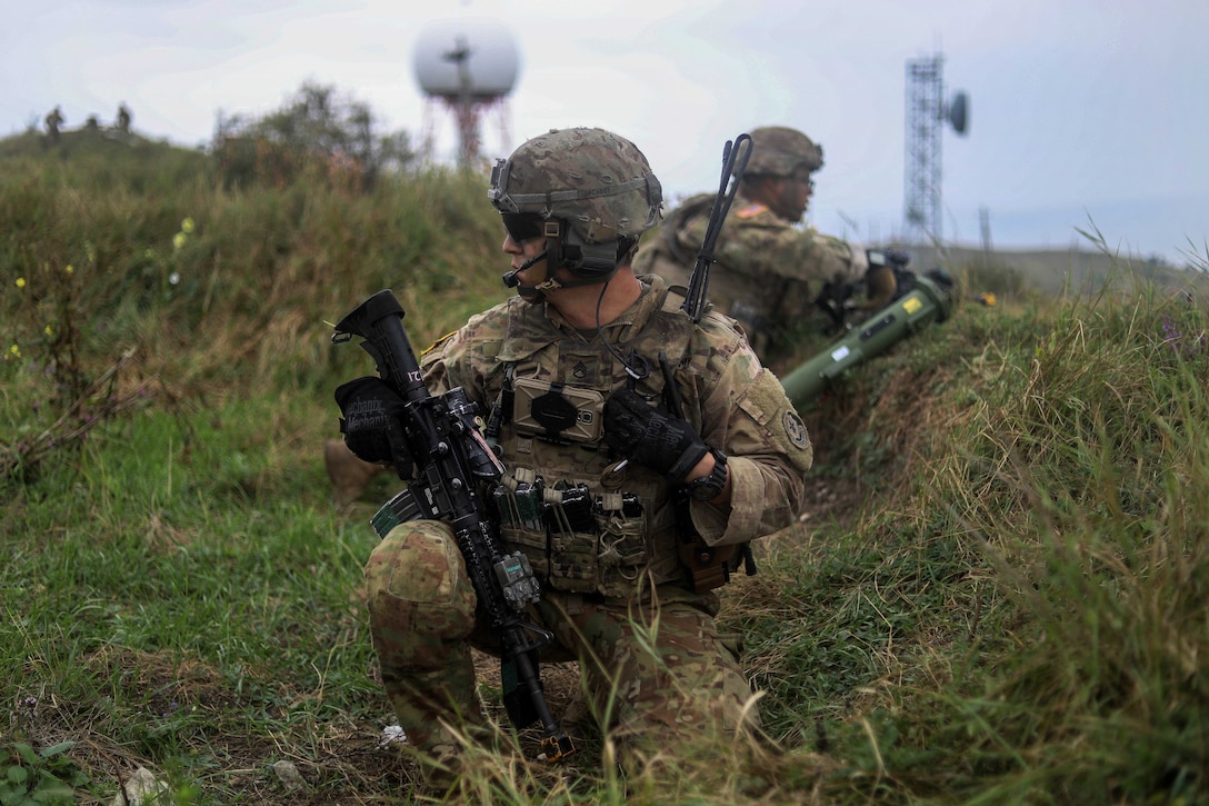 A soldier communicates with his headquarters leadership team.