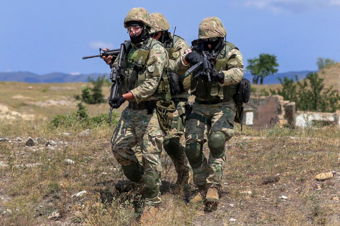 Georgian soldiers maneuver toward their next objective during urban operations training as part of Noble Partner 18 at the Vaziani Training Area, Georgia, Aug. 9, 2018. Army National Guard photo by Staff Sgt.  R. J. Lannom Jr.