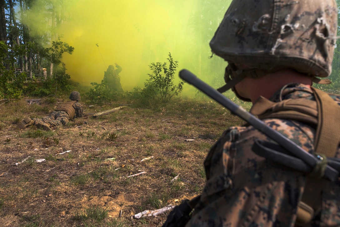 Marines clear a wire obstacle.