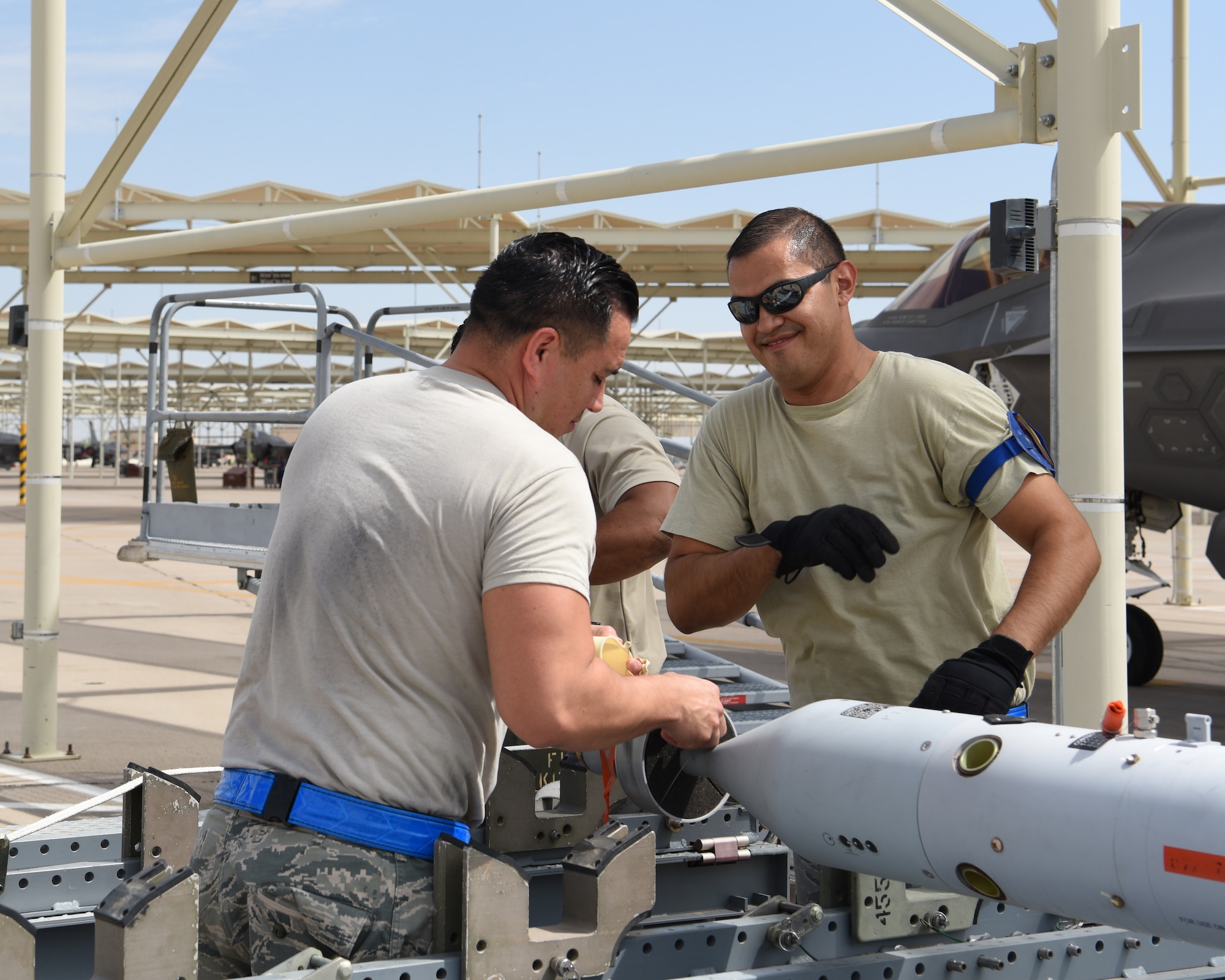 U.S. Air Force Reserve Staff Sgt. Joe Hernandez, 62nd Aircraft Maintenance Unit F-35 Lightning II weapons team chief, and U.S. Air Force Reserve Tech Sgt. Jose Contreras, 62nd AMU F-35 Lightning II weapons load crew member, prepare munitions for aircraft loading, Aug. 15, 2018 at Luke Air Force Base, Ariz.