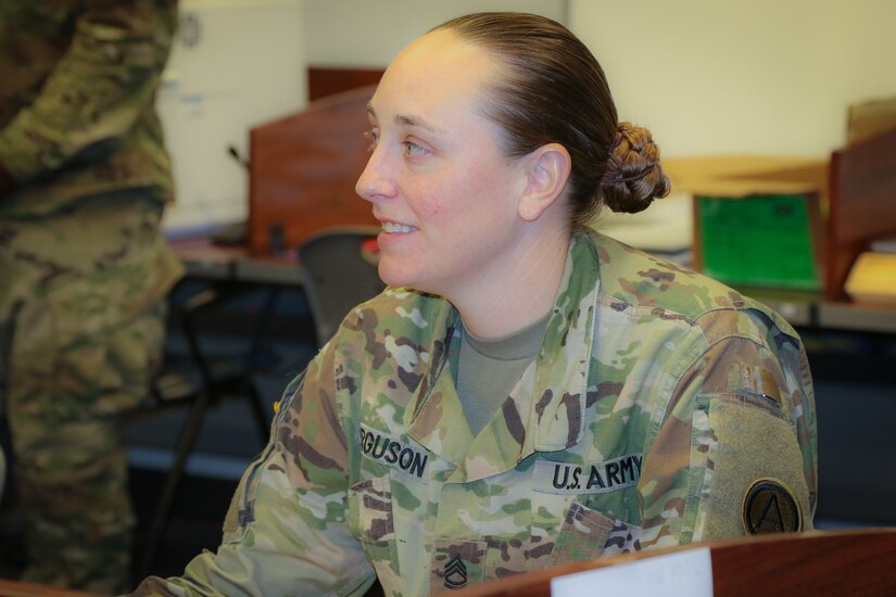 Sgt. 1st Class Heather Ferguson, a signal operations chief at U.S. Army Central, listens to the course instructor during her participation in the Battle Staff Noncommissioned Officers Course at USARCENT headquarters on Shaw Air Force Base, S.C., July 27, 2018. BSNCOC provides technical and tactical curriculum relevant to the missions, duties and responsibilities assigned to battle staff members.