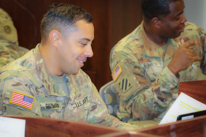 (Pictured left) Staff Sgt. Eric Guzman, an air missile defense operations sergeant at the 2503rd Digital Liaison Detachment, U.S. Army Central, reviews a document during his participation in the Battle Staff Noncommissioned Officers Course at USARCENT headquarters on Shaw Air Force Base, S.C., July 27, 2018. BSNCOC provides technical and tactical curriculum relevant to the missions, duties and responsibilities assigned to battle staff members.