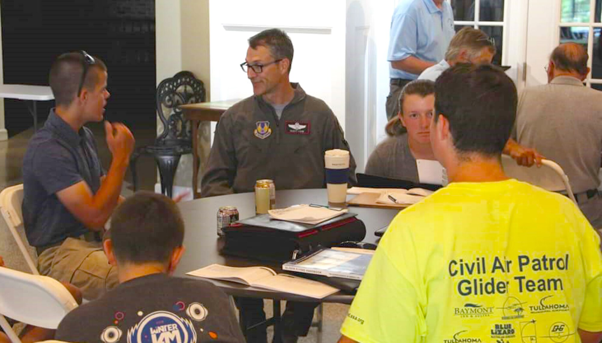 AEDC Commander Col. Scott Cain speaks about his glider experience and flight career to the graduating Civil Air Patrol Glider Team July 13 at the Beechcraft Heritage Museum, Tullahoma. Twenty cadets from across the country graduated and received Science, Technology, Engineering and Mathematics coins from Cain at the conclusion of the CAP South East Region Glider Academy held at the Tullahoma Airport and supported by the Arnold Air Force STEM Program. (Courtesy photos)