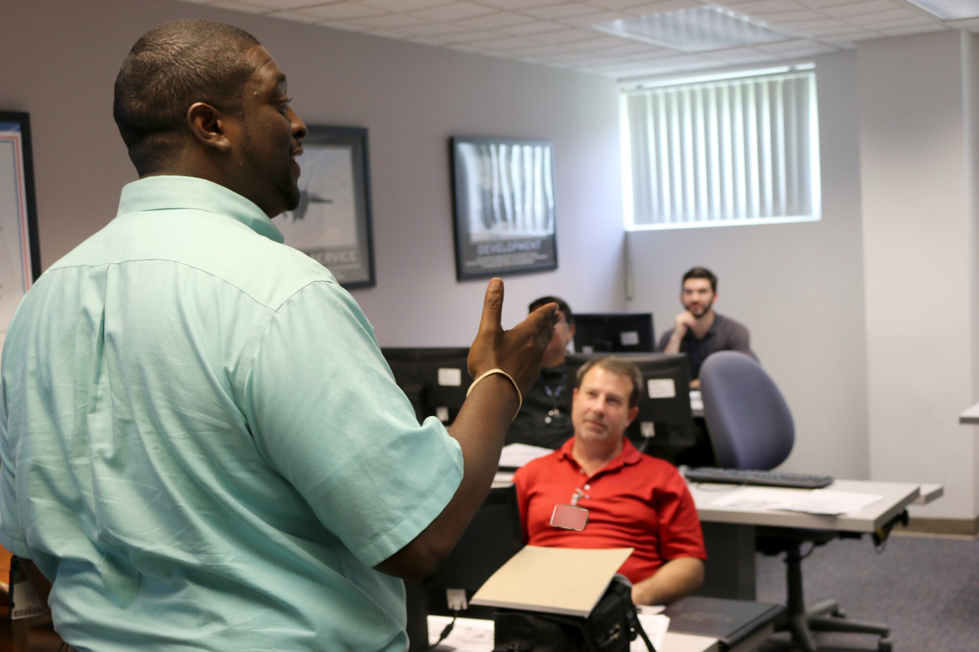 Julius Lockett, a systems engineer in the Engine Test Facility, leads a recent Ground Test University class. The purpose of GTU is to provide younger members of the AEDC workforce and their more-tenured counterparts in new positions with knowledge and information to help them more effectively complete job tasks. (U.S. Air Force photo by Bradley Hicks) (This image was manipulated by obscuring badges for security purposes)